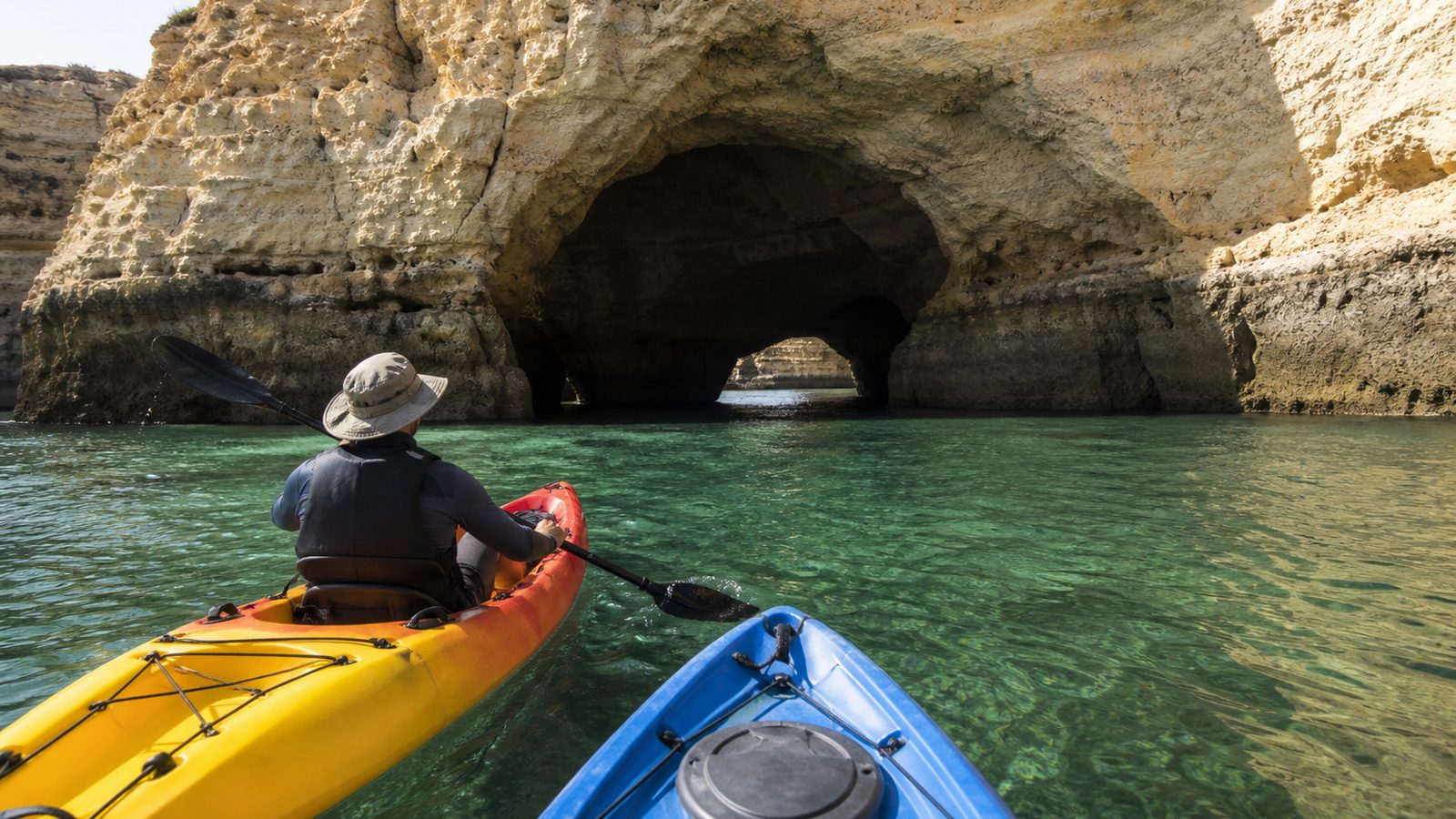 Two kayaks heading toward an Algarve sea cave
